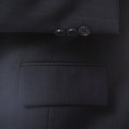Navy pinstripe wool-blend blazer with notch lapel and three-button closure