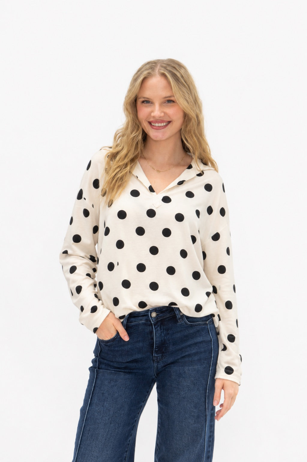 Black polka dot V-neck collared pullover with long sleeves