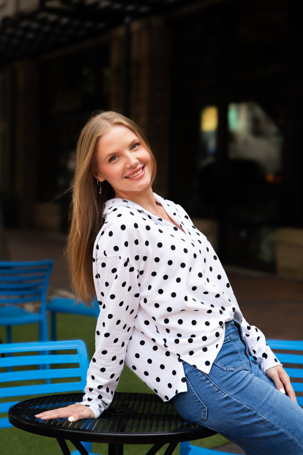 Black polka dot V-neck collared pullover with long sleeves
